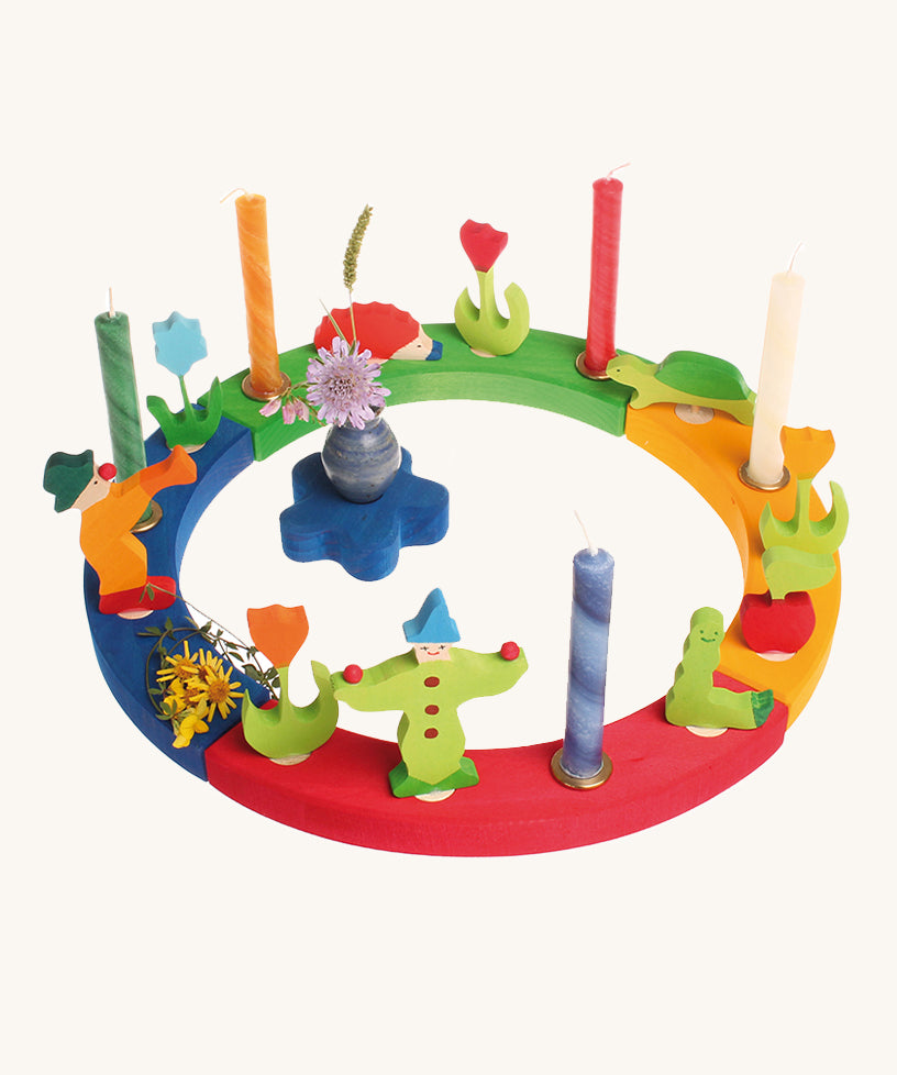 Grimm's 16-Hole Coloured Wooden Celebration Ring with candles and decorative figures