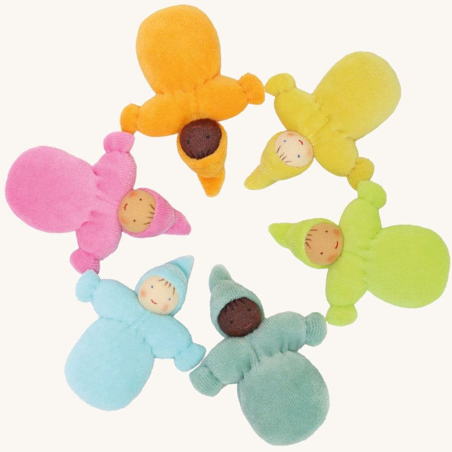 Grimm's Pastel Dwarfs, placed in a circle. Each doll is one colour of the rainbow and is light blue, teal, green, yellow and pink. Each doll has a warm smiling face and a pointed hat. The image is on a cream background