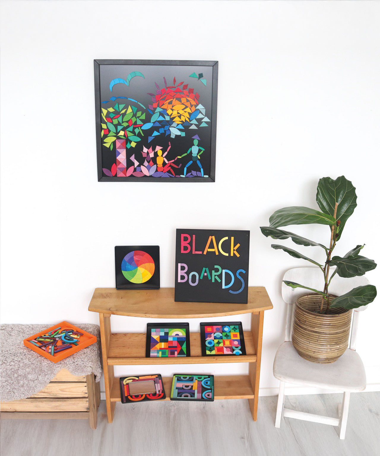 A selection of Grimm's magnetic blackboards with various magnetic pieces on them, to show the different sizes and different works of art