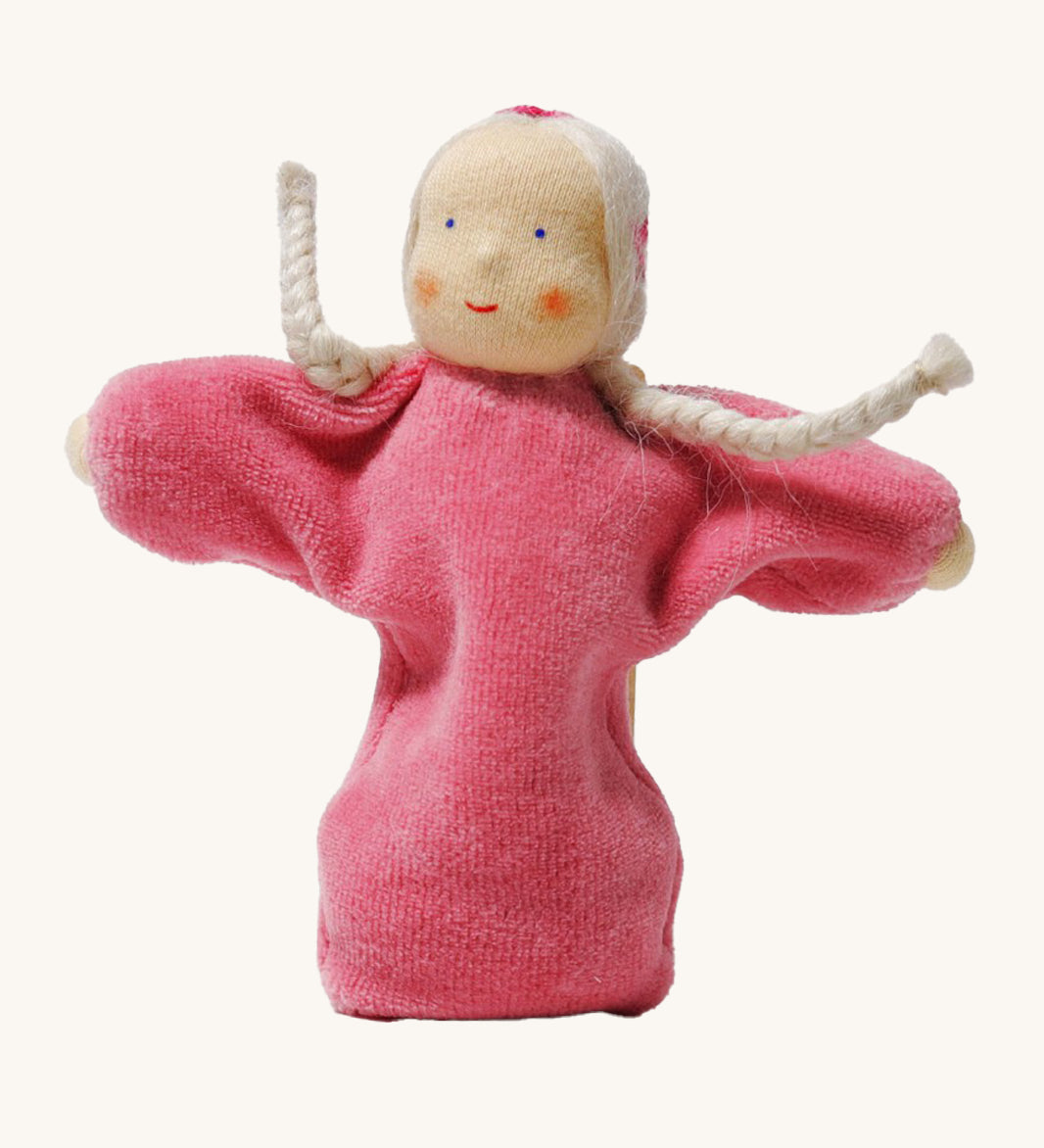 Grimm's Pink Lavender Girl is a lovely Waldorf inspired, soft body doll with a pink body, braided white hair with embroidered ribbon details in the hair. The image is on a white background