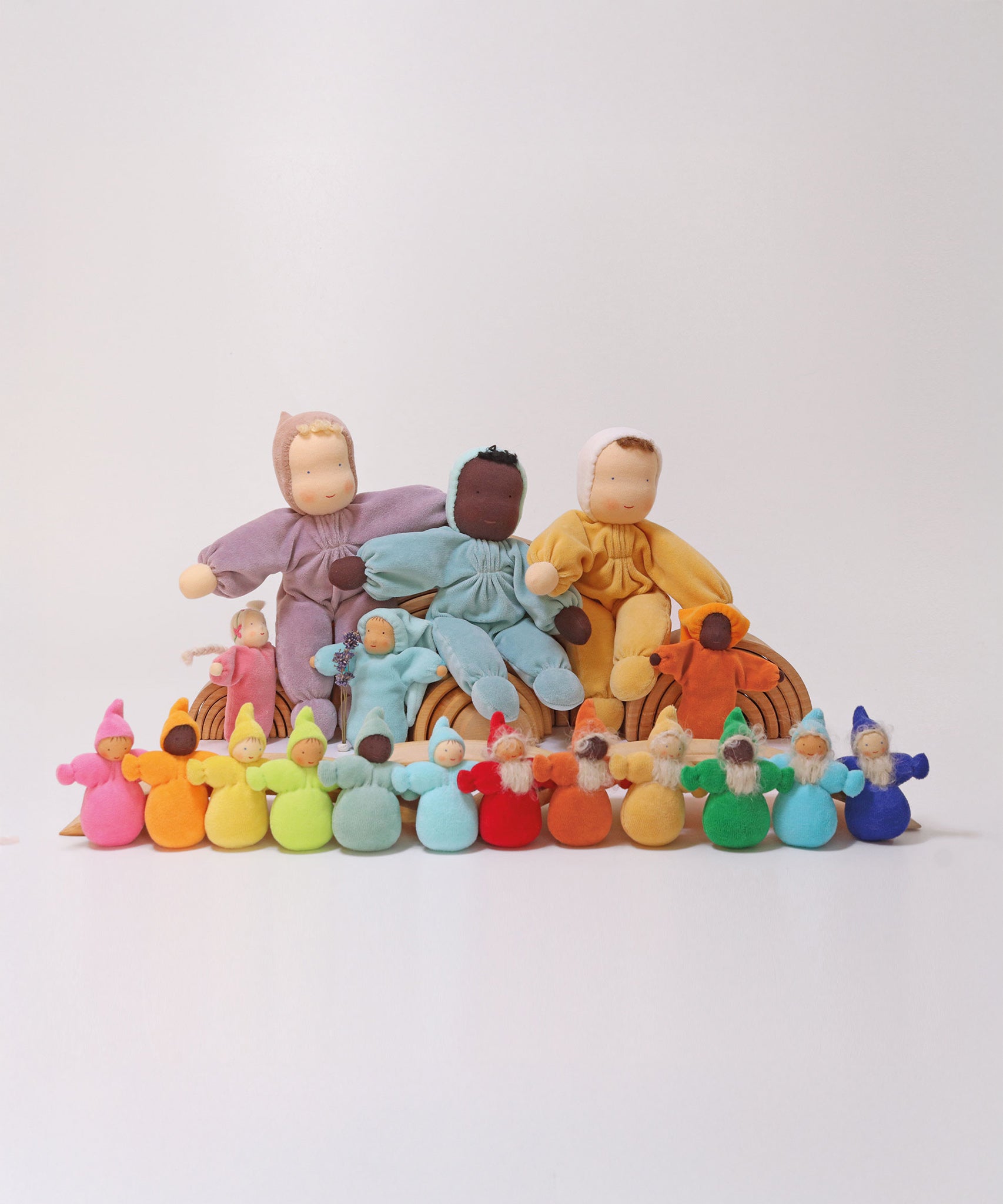 A collection of Grimm's dolls which includes the Grimm's Rainbow Dwarfs, Grimm's Pastel Dwarfs, Grimm's Viola doll, Grimm's Aqua doll, Grimm's Lavender Doll Sun, Grimm's Lavender Doll Aqua, Grimm's Yellow Soft Body Doll,