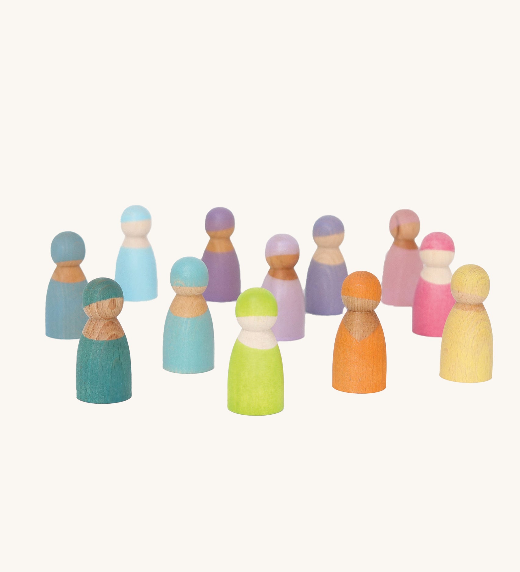 Grimm's 12 Pastel Friends, hand painted wooden peg dolls in hues of blue, pink, purple orange, green and yellow stood on a cream background