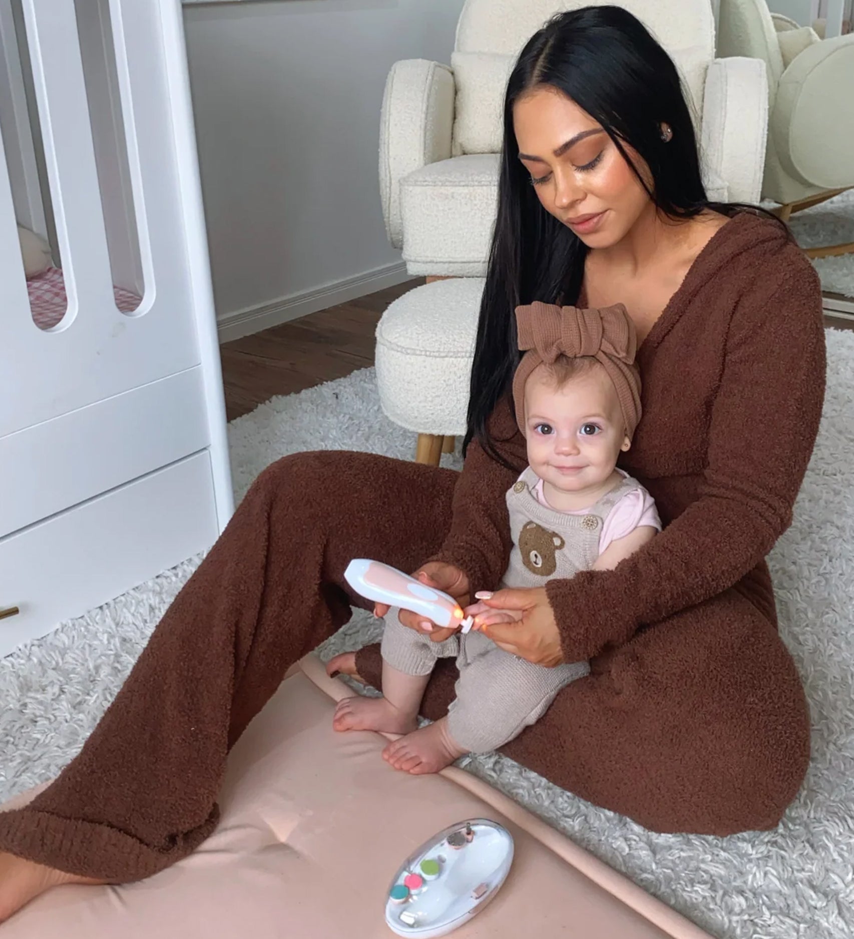 A parent using the Baby Nail Care Set, on their child's finger nails