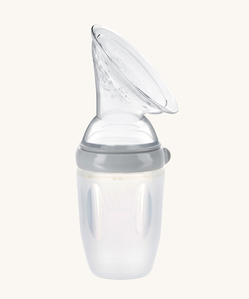 The Haakaa Generation 3 Silicone Breast Pump Shield Attachment, is attached to a Haakaa baby bottle