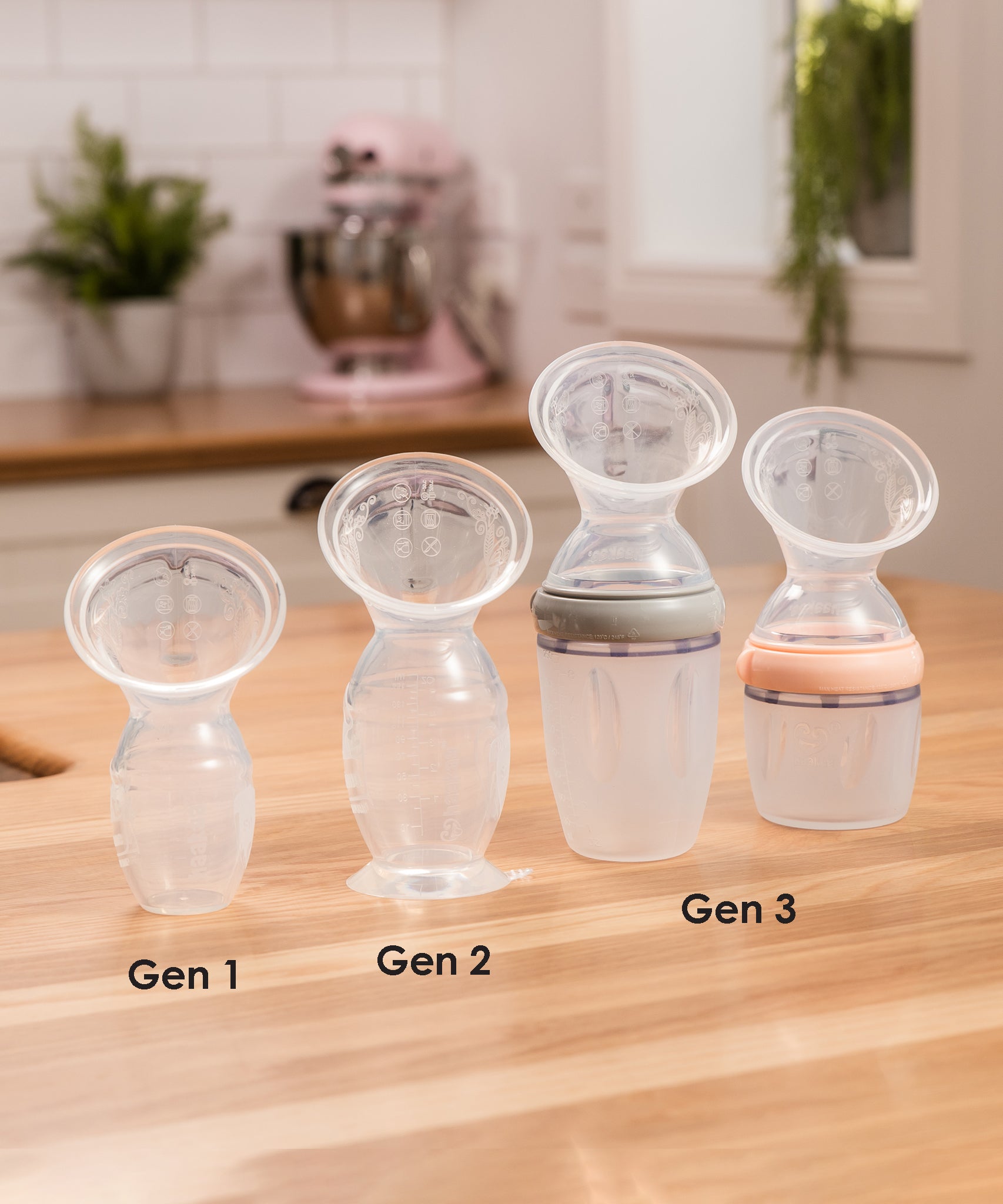 A collection of Haaka Breast Pumps from Generation 1, 2 and 3, each with various attachments