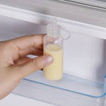 The Haakaa Silicone Colostrum Collector, being stored in the fridge