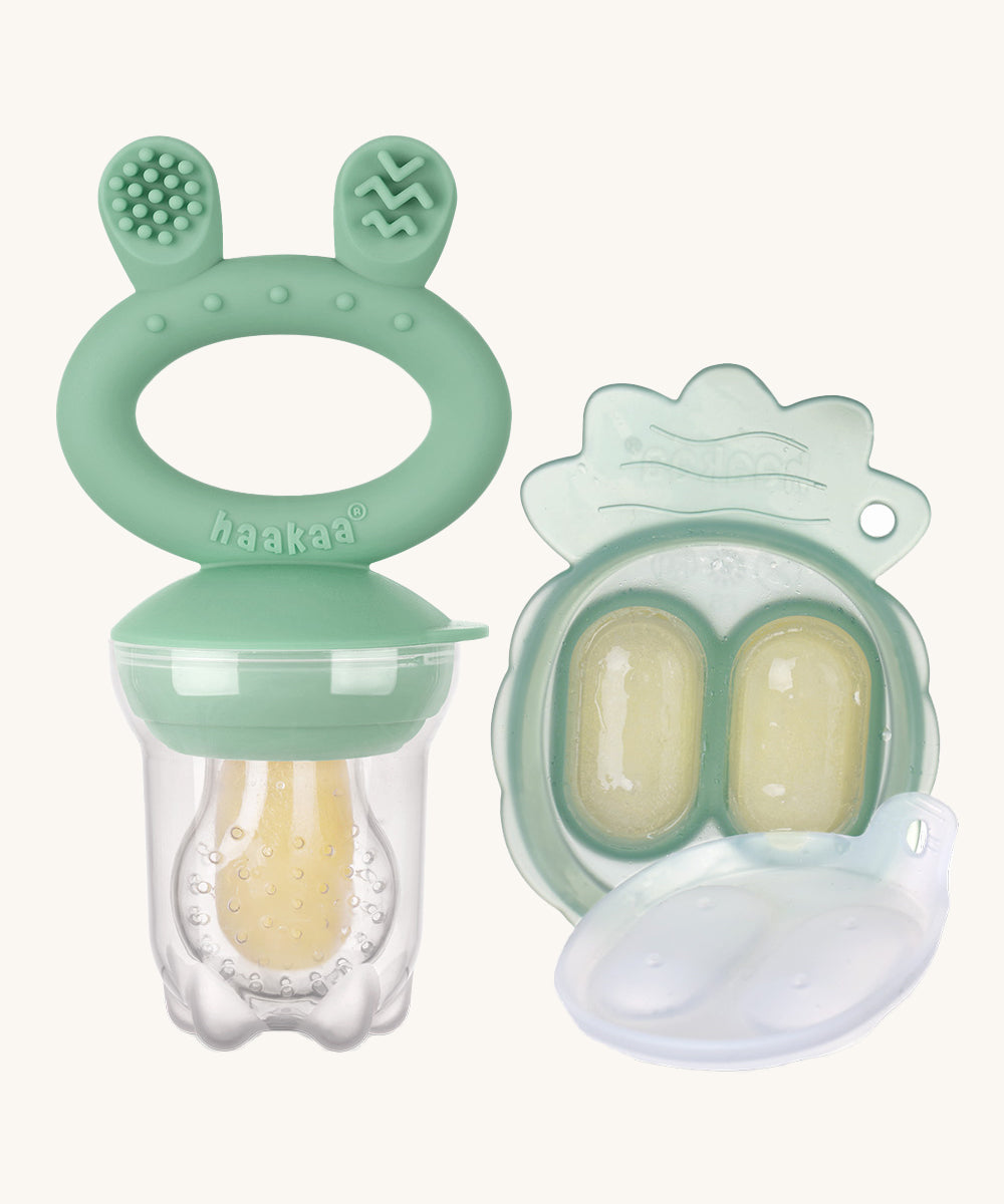 The Haakaa Fresh Food Feeder Mini Freeze and Feed set in green, comes with a Nibble Tray, and a feeder. Both are freezable and the feeder is textured to sooth teething and sore gums