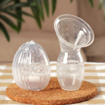 The Generation 1 100ml Silicone Breast Pump, and the Haakaa Silicone Shell Breast Pump and Milk Collector side by side