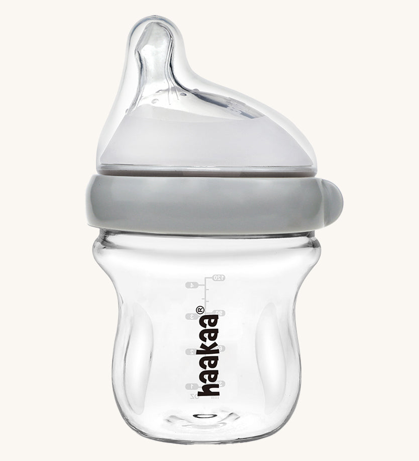 The Haakaa Generation 3 Glass Baby Bottle 120ml, in grey on a cream background