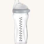 The Haakaa Generation 3 Glass Baby Bottle 300ml in grey, on a cream background