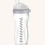 The Haakaa Generation 3 Glass Baby Bottle 300ml in grey, on a cream background