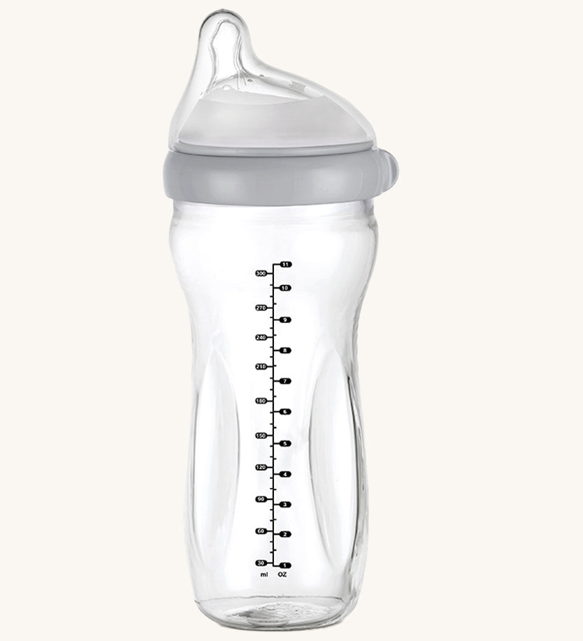 The Haakaa Generation 3 Glass Baby Bottle 300ml in grey, on a cream background