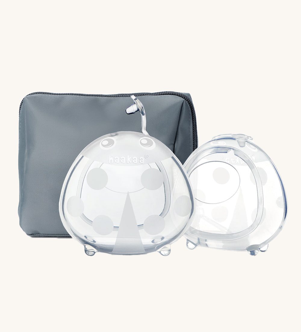 The Haakaa Ladybug Silicone Breast Milk Collector and storage bag in Bluestone, which is a slate grey/blue colour. On a cream background