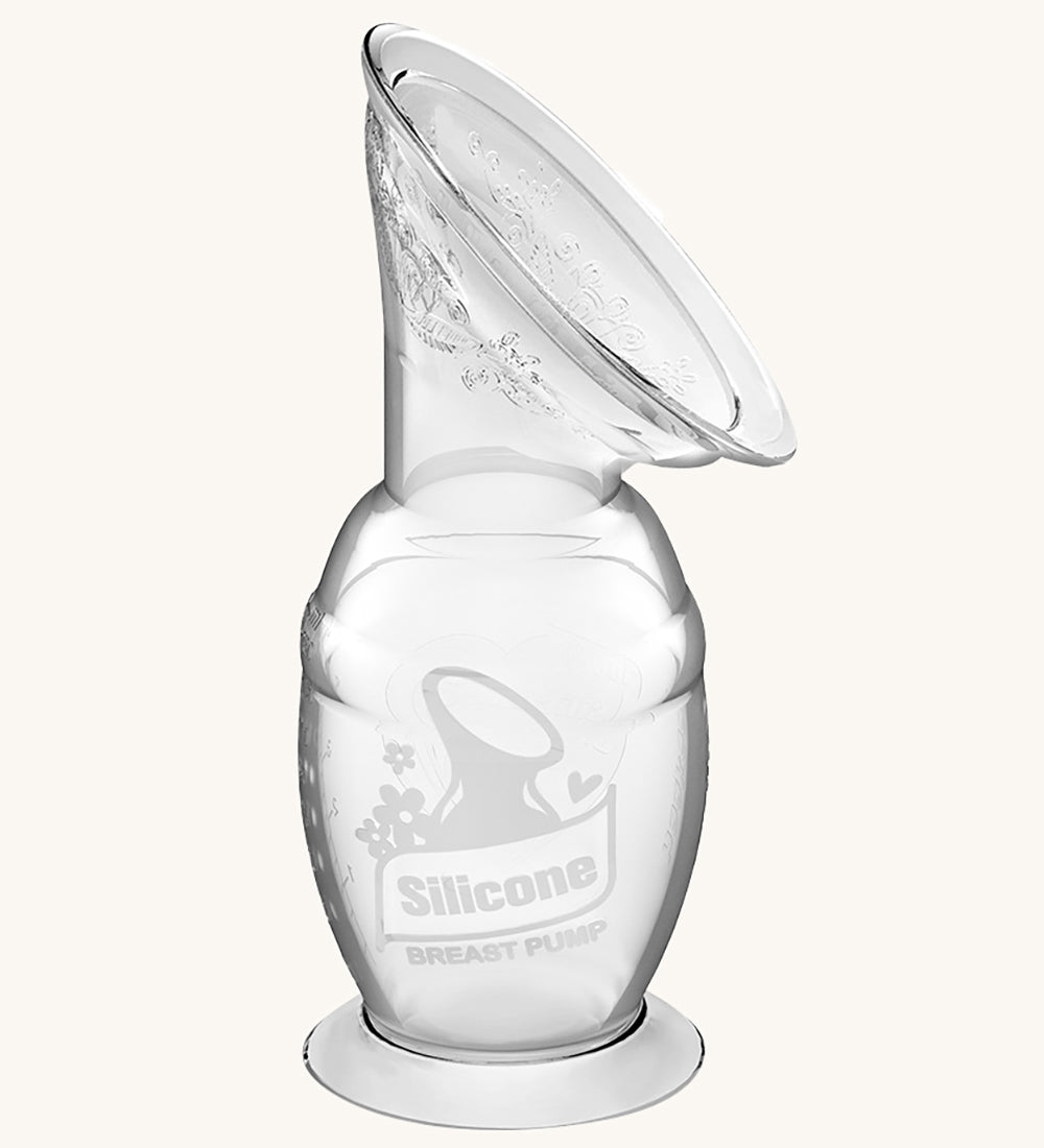 The Haakaa Generation 2 150ml Silicone Breast Pump with Suction Base, on a cream background 