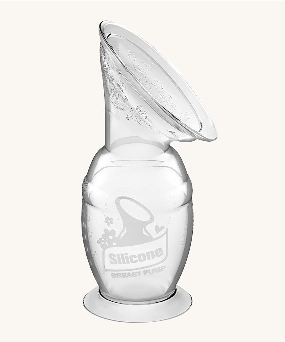 The Haakaa Generation 2 150ml Silicone Breast Pump with Suction Base, on a cream background 