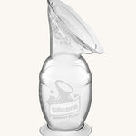 The Haakaa Generation 2 150ml Silicone Breast Pump with Suction Base, on a cream background 