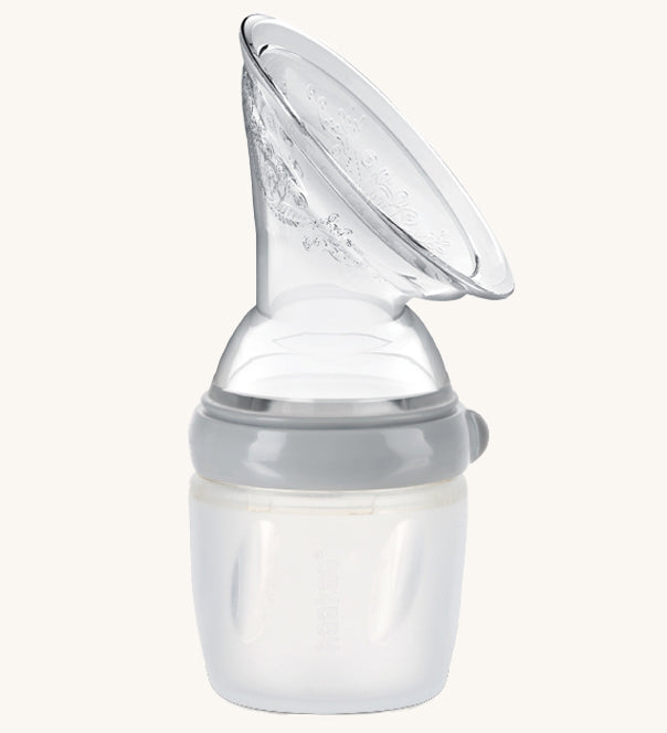 The Haakaa Generation 3 160/250ml Silicone Breast Pump in grey on a cream background