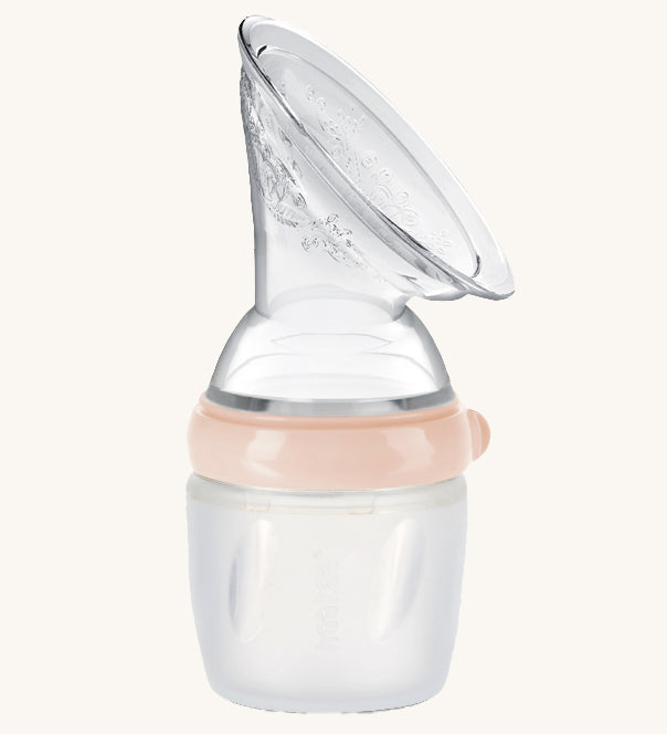 Generation 3 160ml Silicone Breast Pump in peach on a cream background