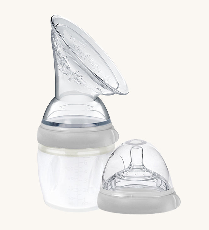 The Generation 3 160ml Breast Pump and Baby Bottle Top in grey. on a cream background. This set come with the Haakaa Gen. 3 Silicone Breast Pump and Baby Bottle Top.