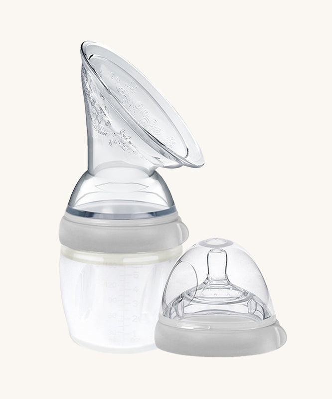 The Generation 3 160ml Breast Pump and Baby Bottle Top in grey. on a cream background. This set come with the Haakaa Gen. 3 Silicone Breast Pump and Baby Bottle Top.