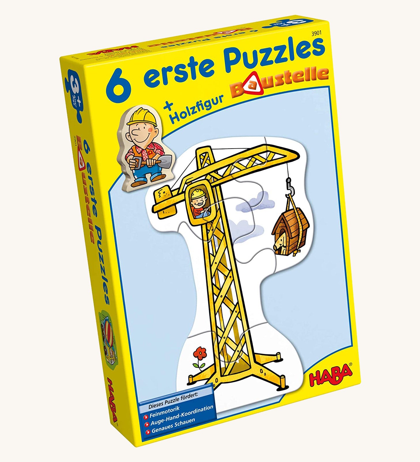 A yellow cardboard box with a picture of a crane on the front for the Haba 6 construction jigsaw puzzle sets on a cream background