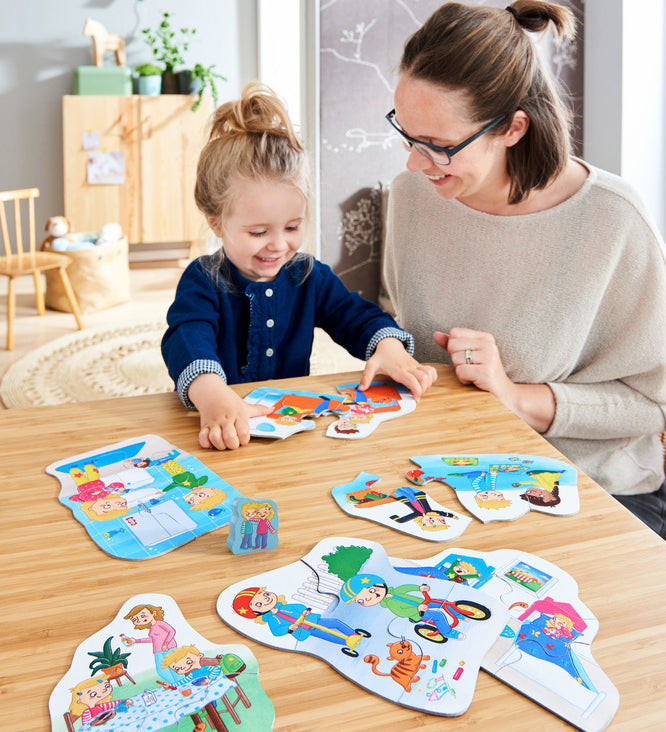 A mother and child playing with the Haba my day jigsaw puzzle set