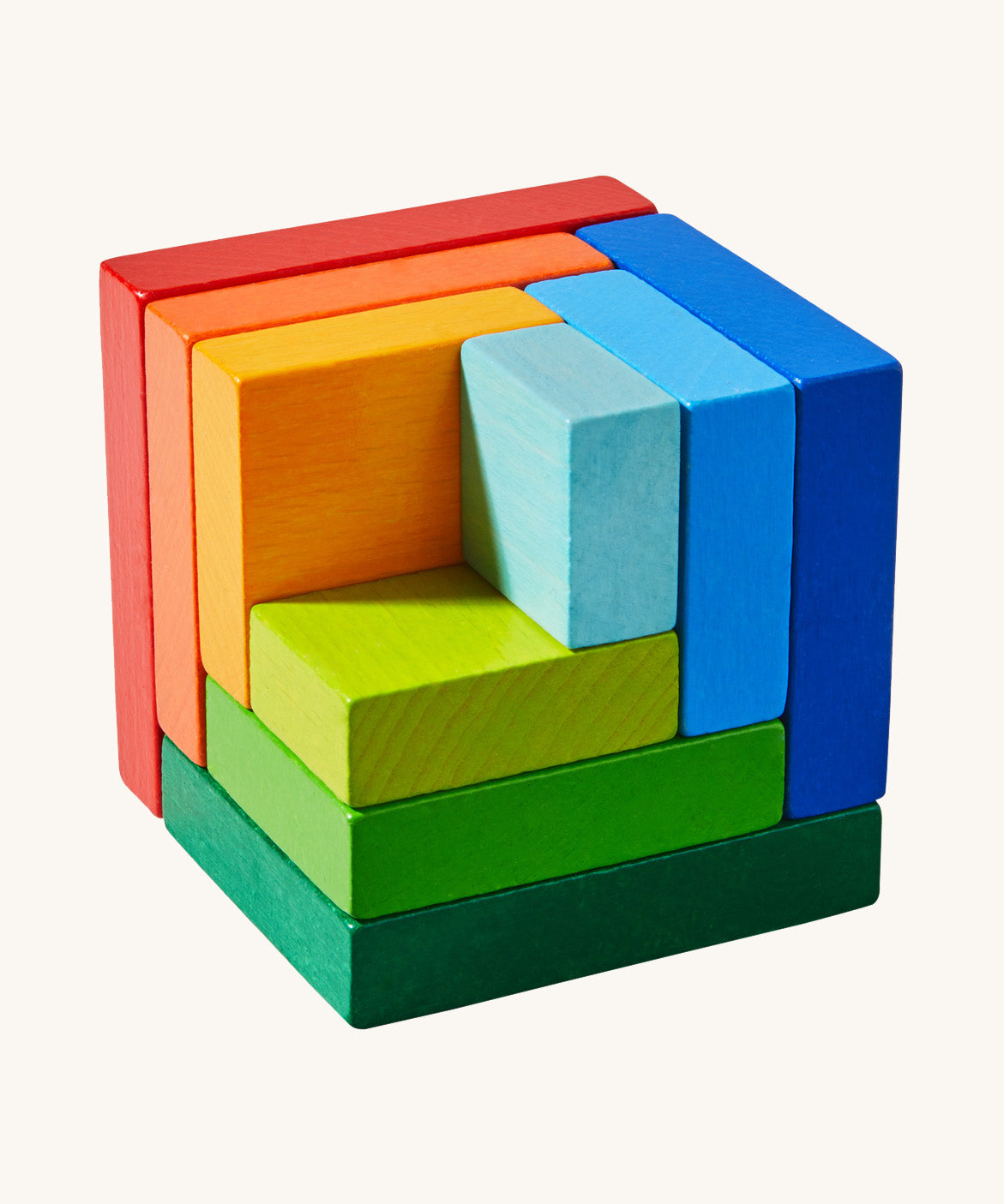 A wooden 3D Haba rainbow cube arranging puzzle game on a cream background.