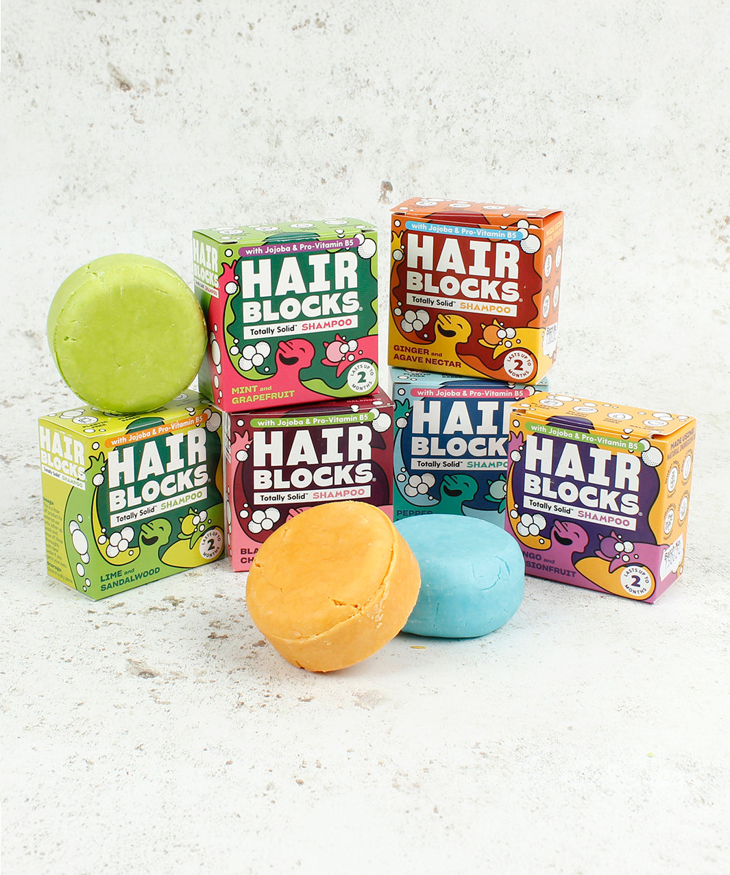 Hair Blocks Solid Shampoo Bars with their cardboard boxes