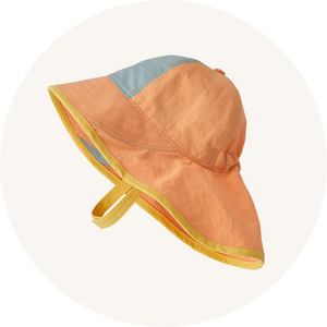 Patagonia sun hat on cream background to represent baby hats and gloves at Babipur.