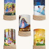 The Waldorf Illustration Set by Het Wol Feetje, featuring 5 different Toverlux Magic Lantern Silhouettes which are: Candle Mass, Bread Roosters, Harvest Angel, Lucia and Advent. The image is on a cream background.