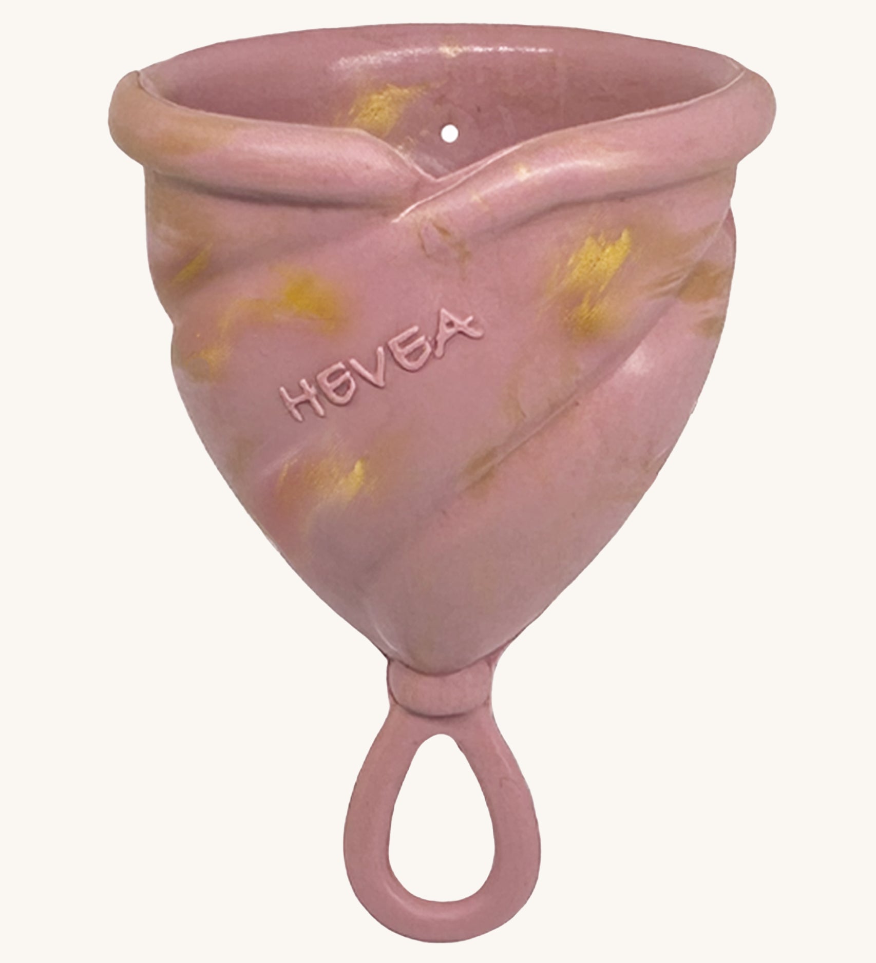 Hevea LOOP Menstrual Cup Size 3 - Golden Rosewood, a pink rubber menstrual cup with gold flecks and a loop stem.