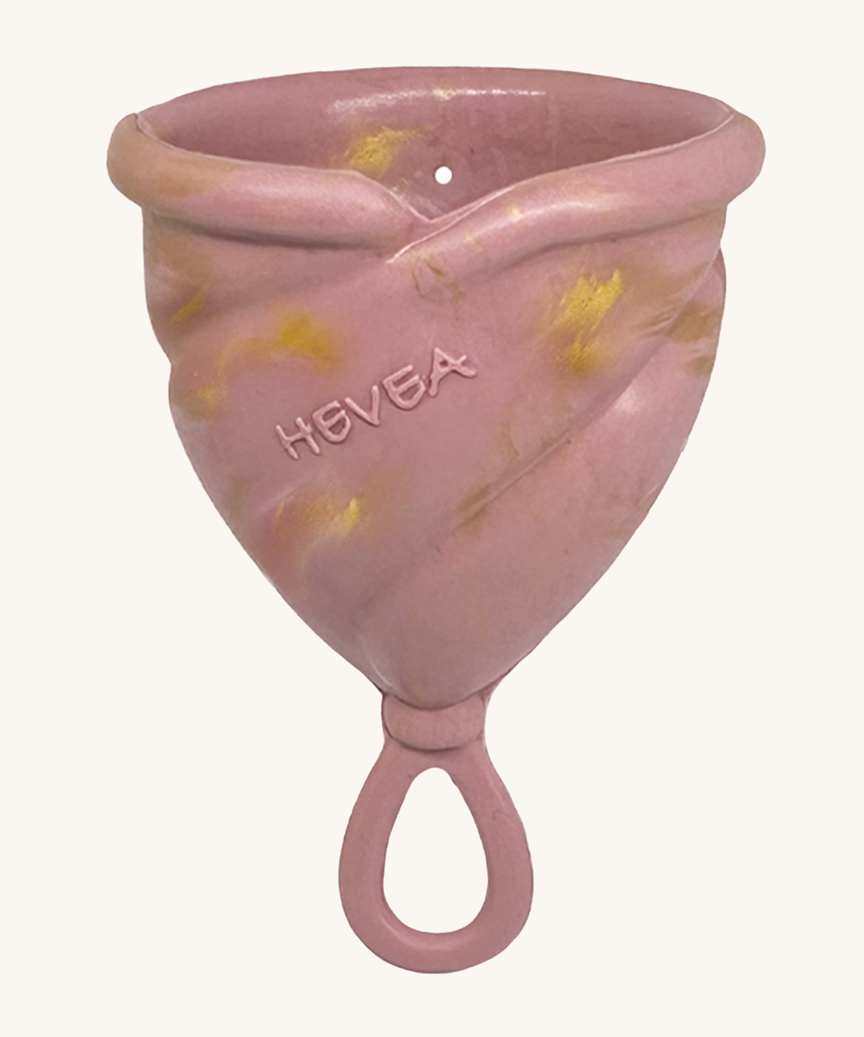 Hevea LOOP Menstrual Cup Size 3 - Golden Rosewood, a pink rubber menstrual cup with gold flecks and a loop stem.