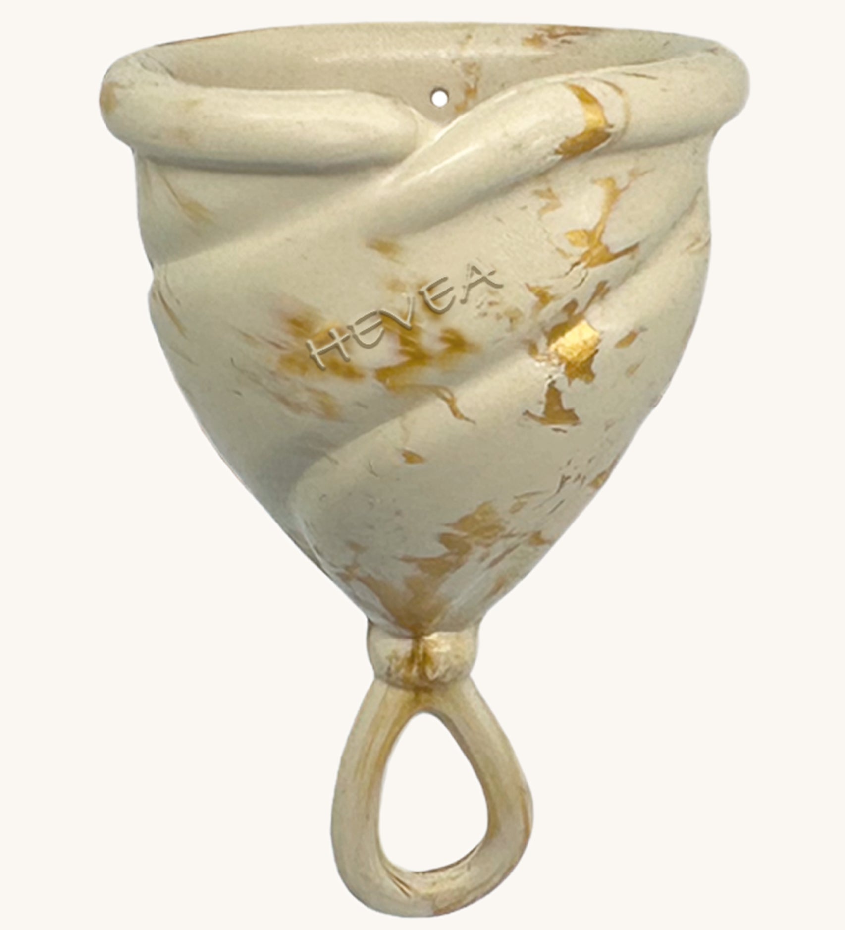 Hevea LOOP Menstrual Cup Size 2 - Golden Sand, a cream natural rubber menstrual cup with gold flecks and a loop stem. 