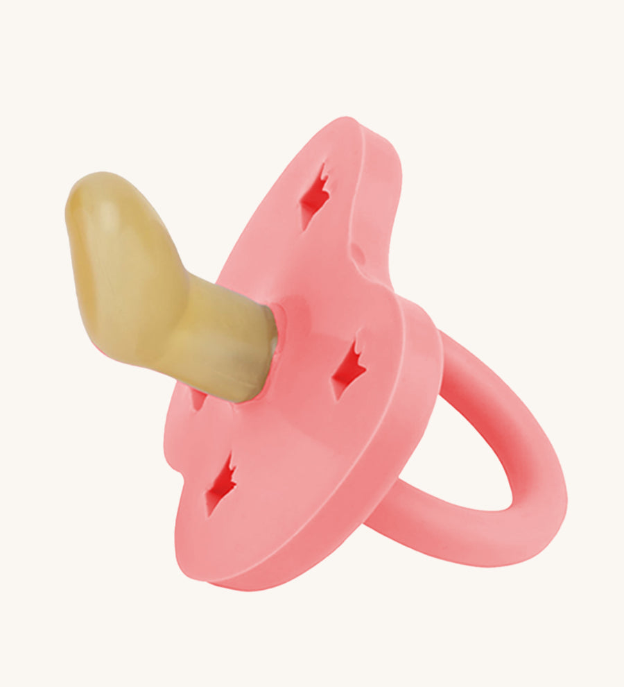 Hevea Orthodontic Baby Pacifier - 3-36 Months in Guava, on a cream background