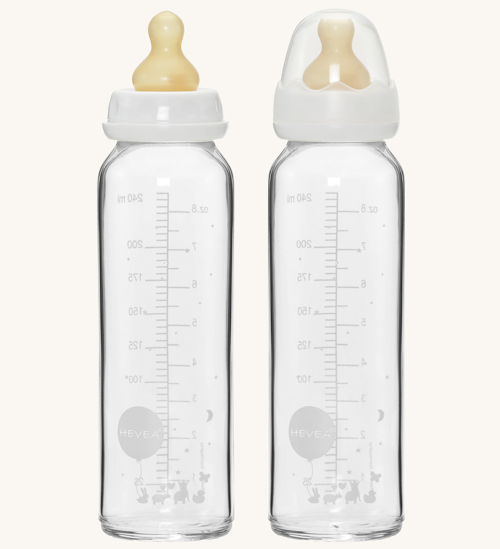 Hevea Glass Baby Bottles Standard Neck 2 Pack - 240ml, one with a dust cap, the other without. 