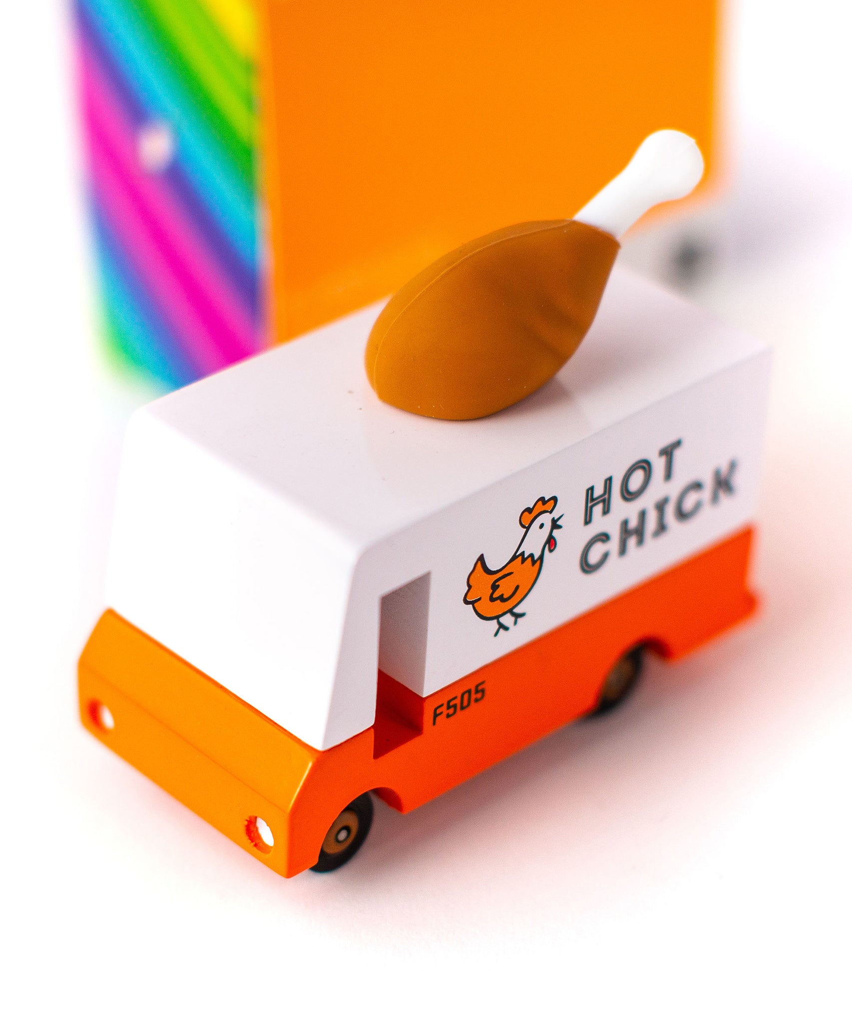 The Candylab Candyvan - Fried Chicken Van, being shown from the top. The images shows a painted chicken on the side of the van with the words "Hot Chick". The rubber chicken drumstick sits on top of the van