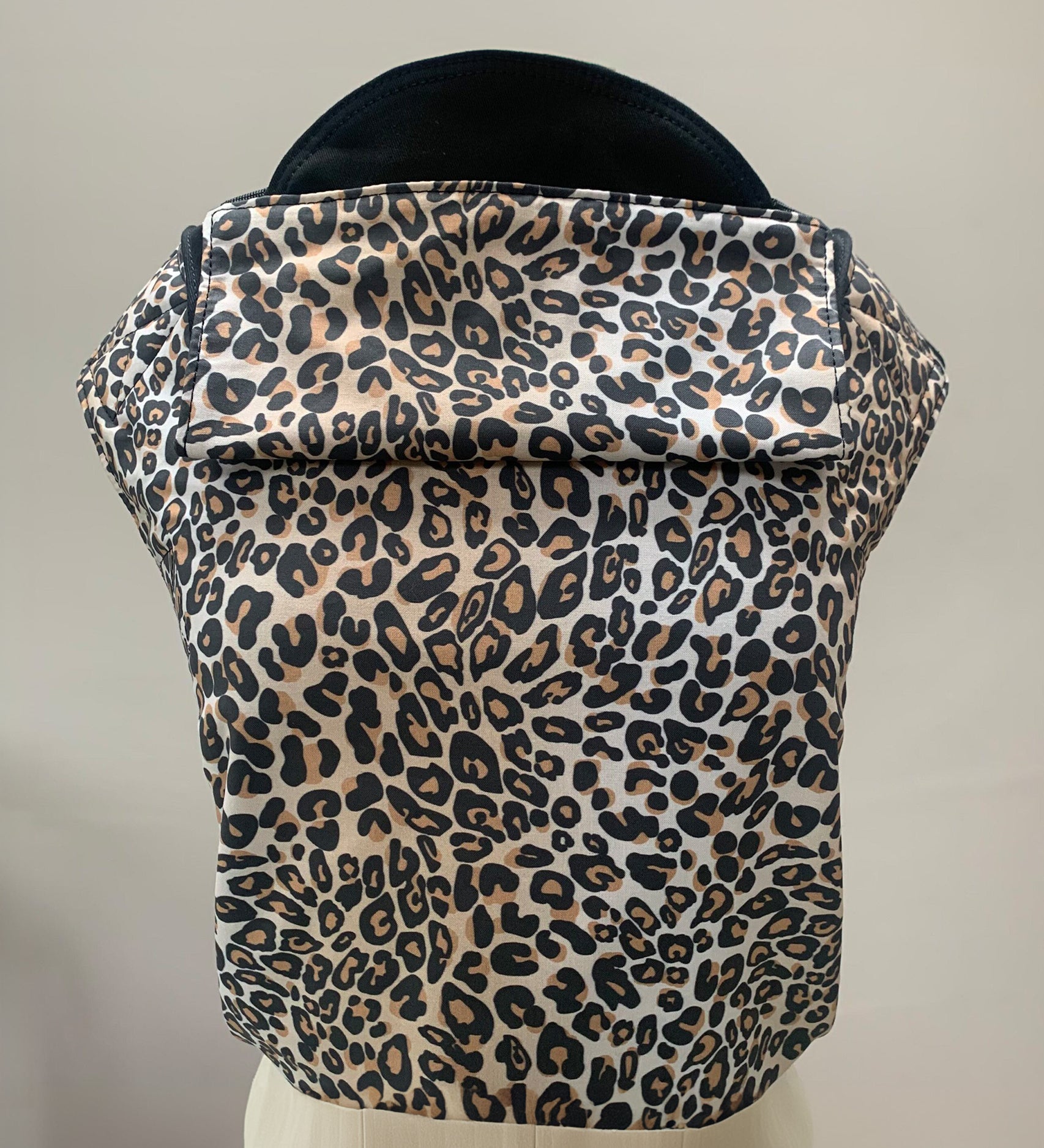 Integra Baby Carrier - Leopard. Leopard is a stylish animal print in soft organic cotton with leopard spots on a cream background.