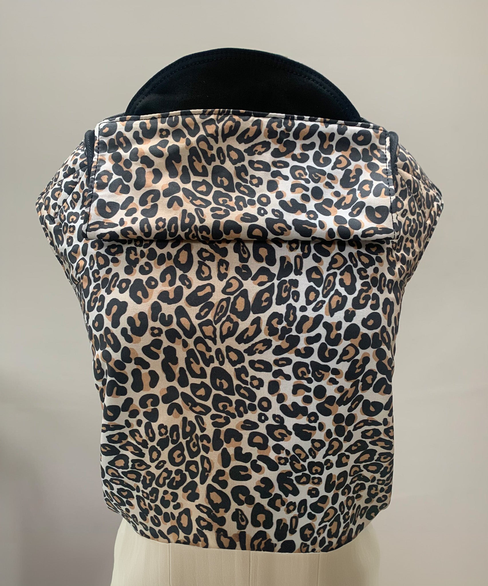 Integra Baby Carrier - Leopard. Leopard is a stylish animal print in soft organic cotton with leopard spots on a cream background.