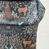 Integra Baby Carrier - Forest Tree. Forest Tree is a beautifully illustrated woodland design in soft organic cotton featuring intricate woodland trees and stags in muted colours on a black background.