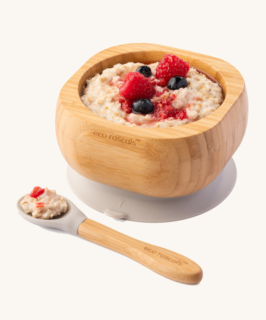 Porridge topped with fresh berries in the Eco Rascals Bamboo Bowl & Spoon Weaning Set in grey silicone.