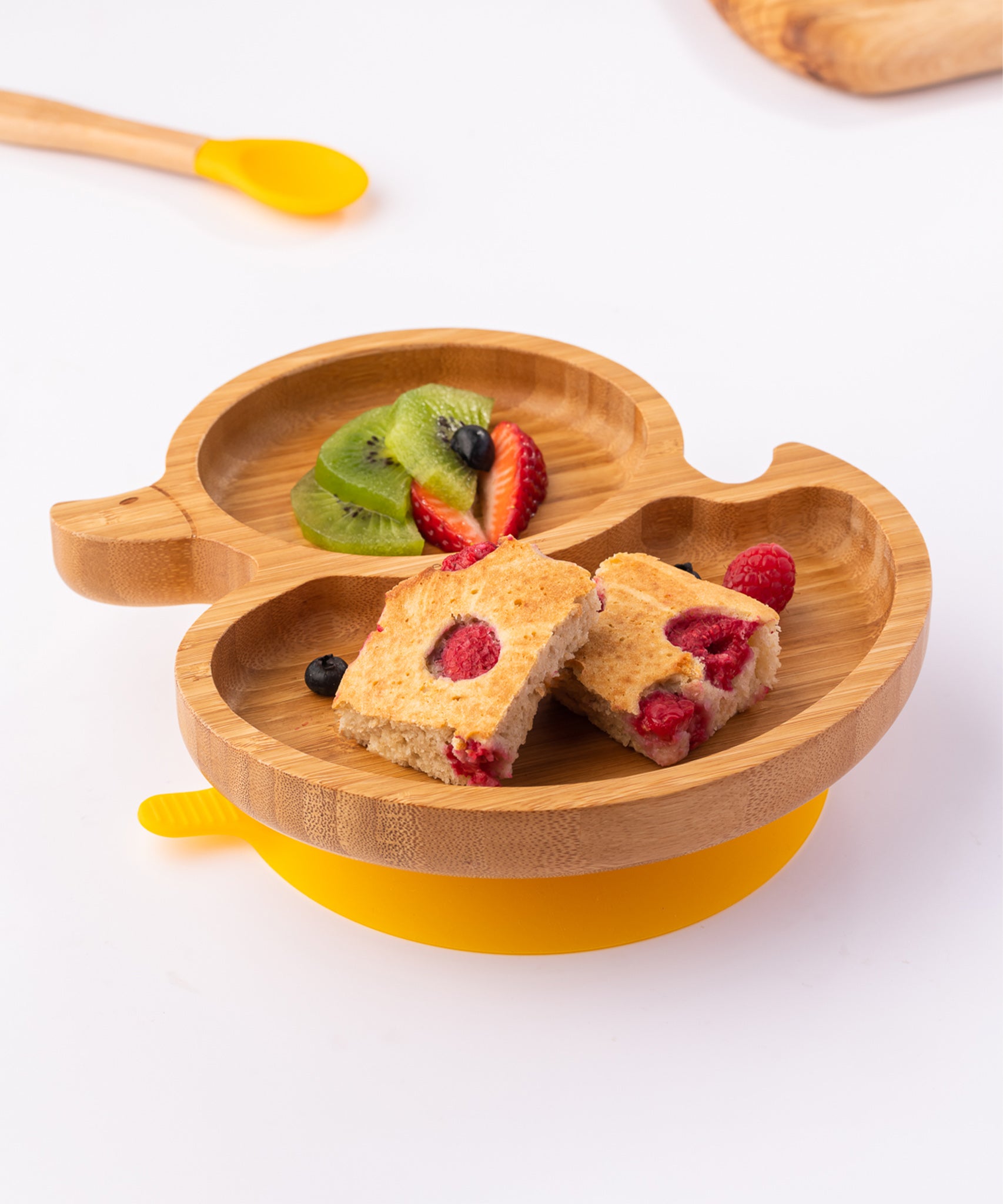 Eco Rascals Duck Bamboo Suction Plate, with fresh fruit and raspberry loaf. 