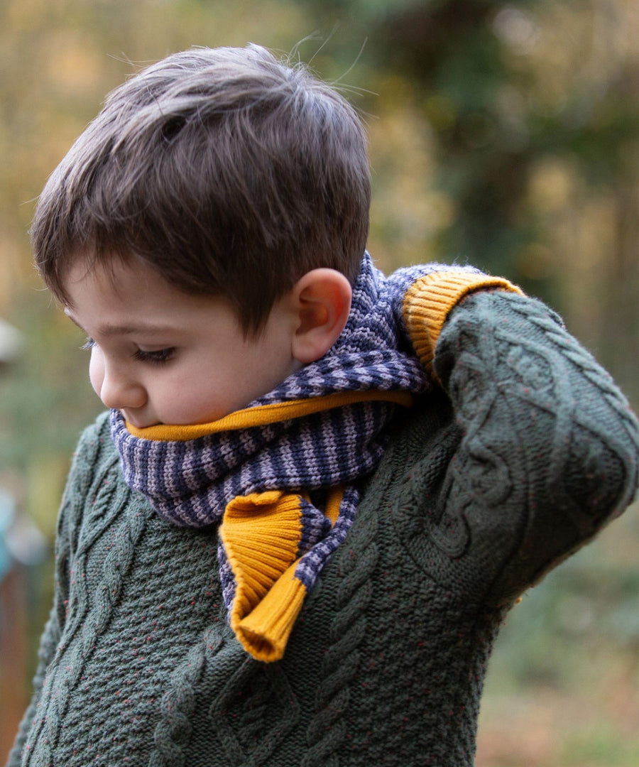 A child wearing the LGR lovely Dreamy Blue Stripe scarf and mittens