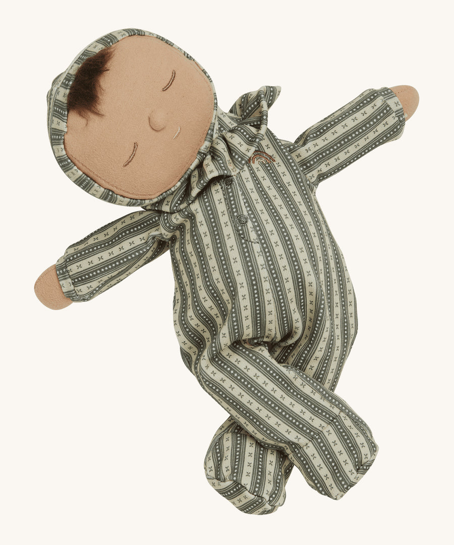 Olli Ella Dozy Dinkum Doll Pie - Clover with its arms out stretched and its legs crossed, to show how the arms and legs move and can pose. On a cream background