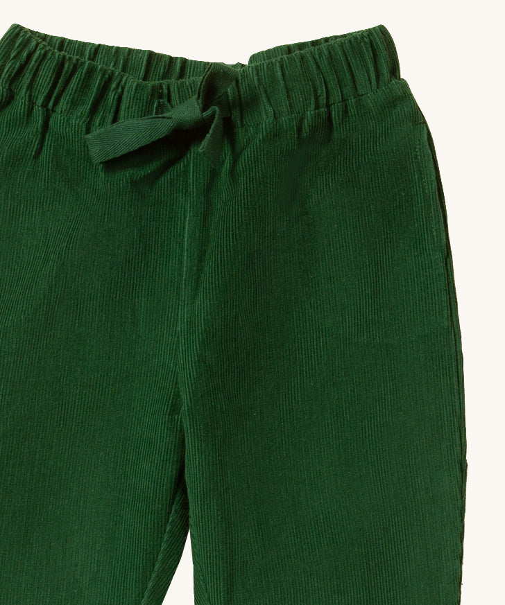 A closer look at the corduroy fabric, elasticated waistband with a pull trough tie on the Little Green Radicals Corduroy Comfy Trousers - Vintage Green