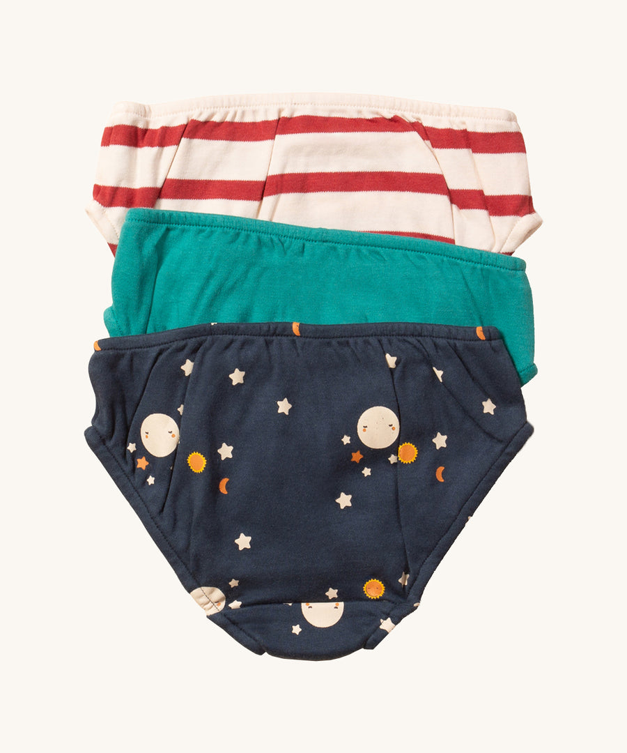 Little Green Radicals Cotton Underwear Set - Over The Moon. One pair of underwear is in a turquoise colourblock, one in a red and cream stripe, and one in midnight blue with a moon and stars print