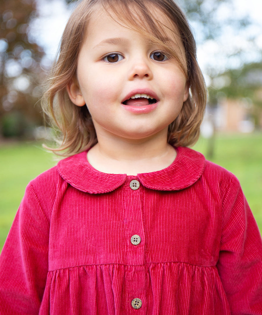 A closer look at the buttons and collar on the Frugi Coco Cord Dress - Lingonberry/Squirrel