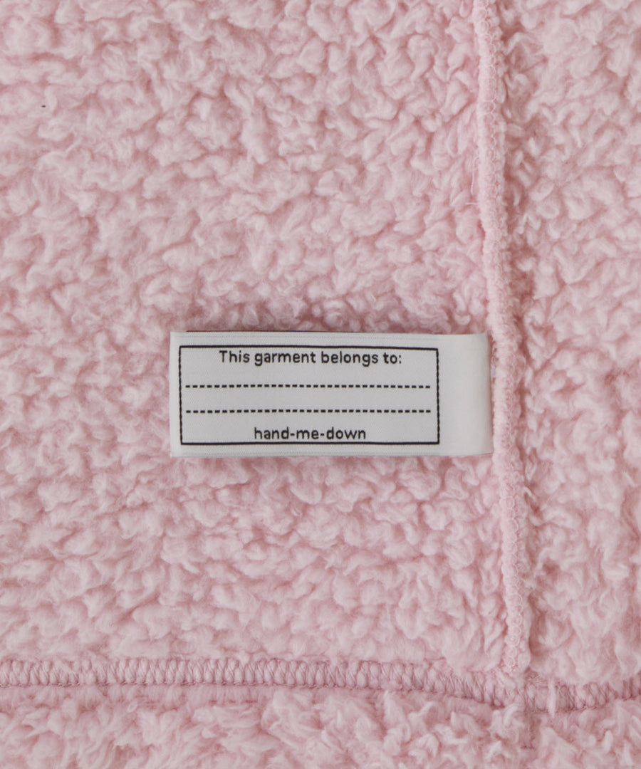 The Hand Me Down label inside the Patagonia Baby Furry Friends Hoody