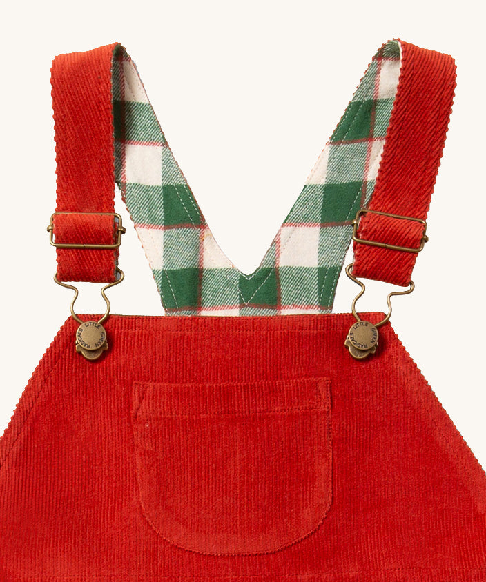 A closer look at the corduroy fabric, pocket, check print and buckle details on the LGR Classic Pinafore Dress - Hazelnut