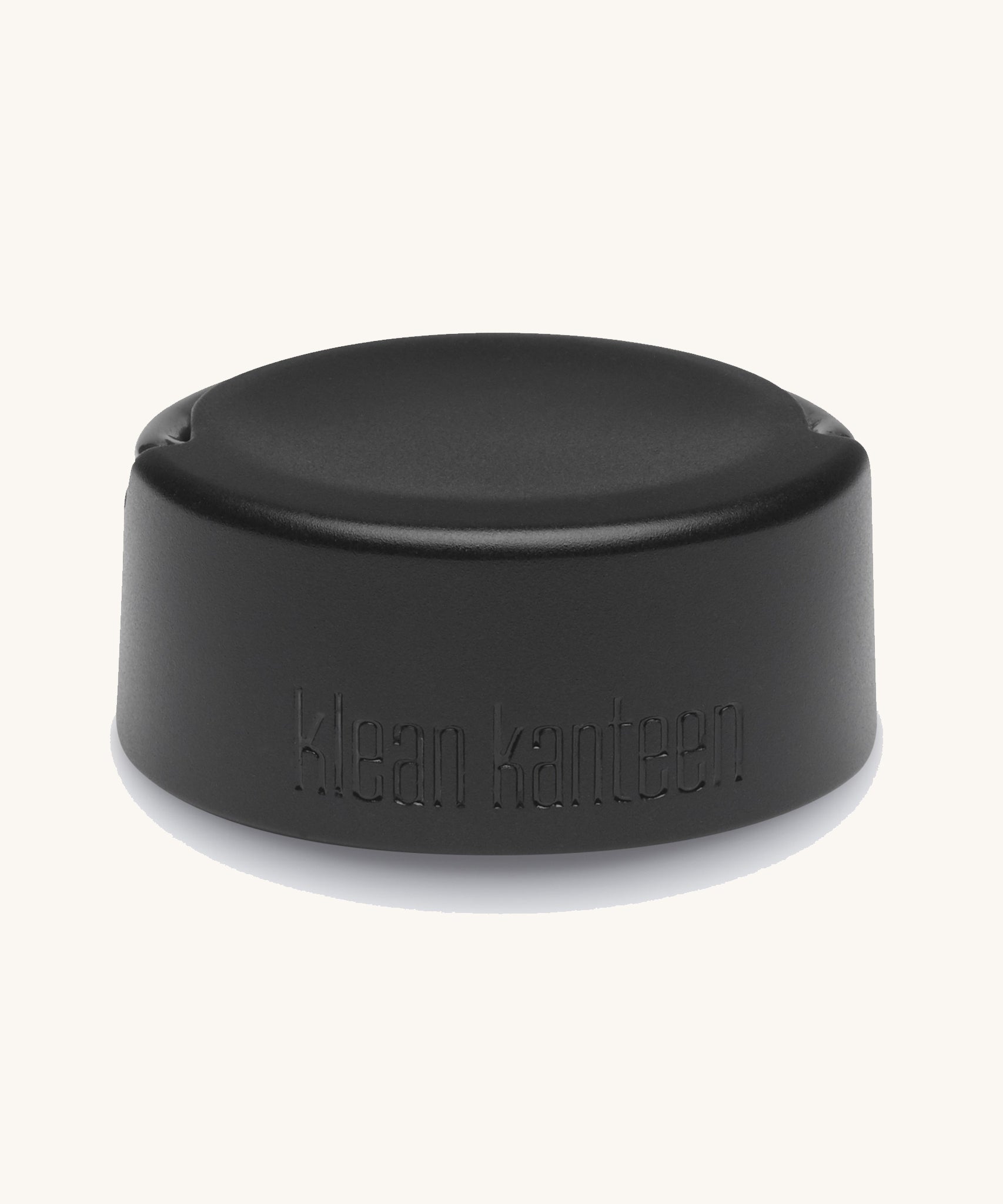 Klean Kanteen Wide Loop Cap - With Bale, in black. A stainless steel cap with carry handle on a plain background