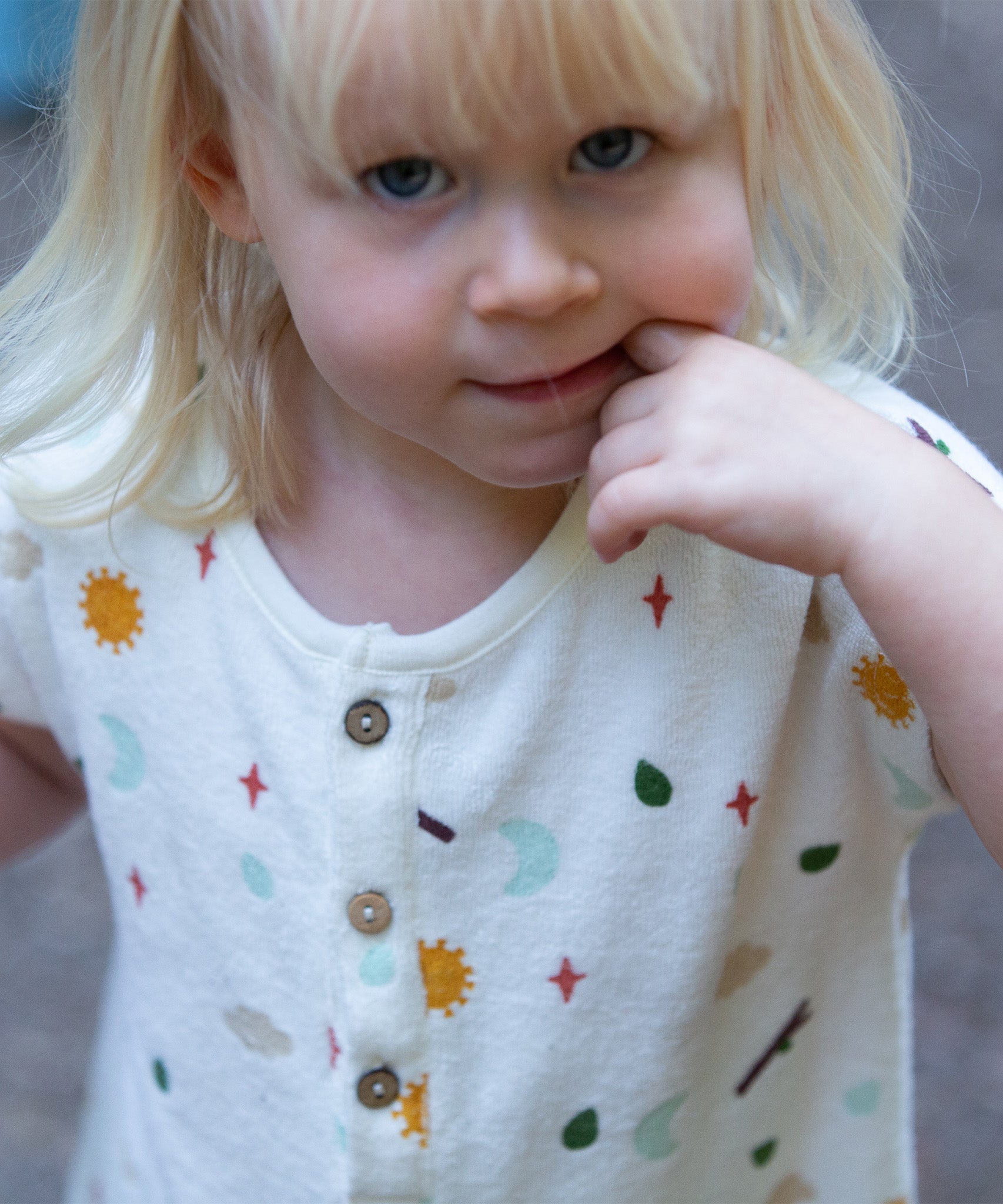 A closer look at the top part and buttons on the LGR Adventure Baby Towelling Romper